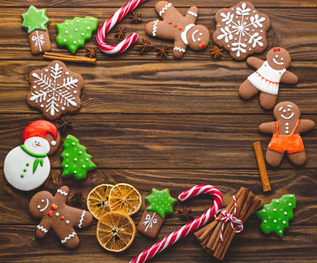 Christmas homemade gingerbread cookies on the wooden backgroundの写真素材