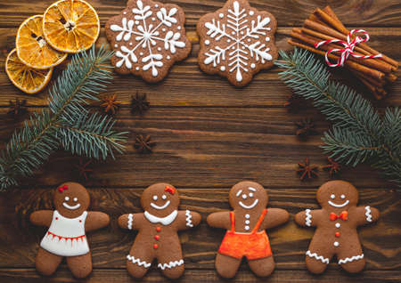 Christmas homemade gingerbread cookies on the wooden backgroundの写真素材