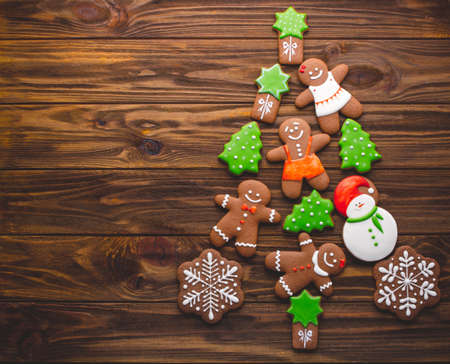 Christmas homemade gingerbread cookies on the wooden backgroundの写真素材