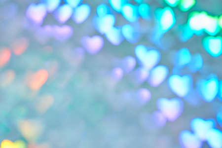 Multicolor space blurred three-dimensional heart-shaped bokeh, neon juicy bright colors, Valentines day, holiday card, abstract backgroundの写真素材