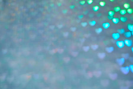 Multicolor space blurred three-dimensional heart-shaped bokeh, neon juicy bright colors, Valentines day, holiday card, abstract backgroundの写真素材