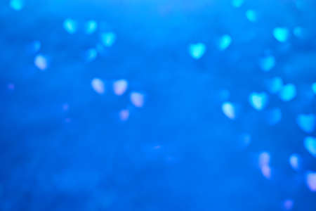 Multicolor space blurred three-dimensional heart-shaped bokeh, neon juicy bright colors, Valentines day, holiday card, abstract backgroundの写真素材