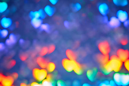 Multicolor space blurred three-dimensional heart-shaped bokeh, neon juicy bright colors, Valentines day, holiday card, abstract backgroundの写真素材