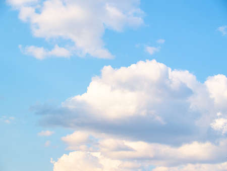 Soft white clouds against blue skyの写真素材