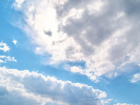 Soft white clouds against blue skyの写真素材
