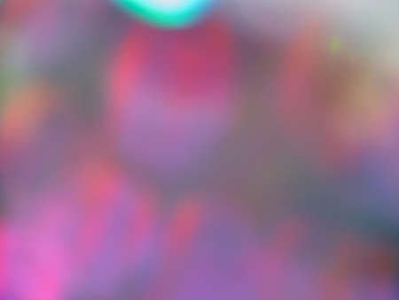 Bright blurry gradient transitions of neon lights, rich color scheme, abstract background, bokeh, space for textの写真素材
