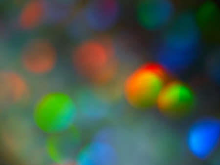 Bright blurry gradient transitions of neon lights, rich color scheme, abstract background, bokeh, space for textの写真素材