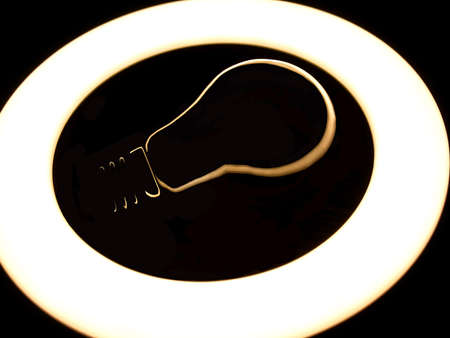 Lamp night light in a dark background. Vintage effect style picture. ring lamp. Incandescent lamp inside LED ring light source Concept photography, the light takes the form of an incandescent lampの写真素材