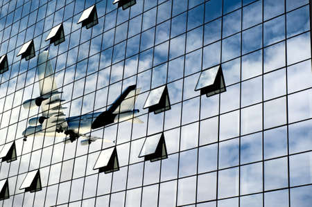Modern airport with airplane reflectionの写真素材