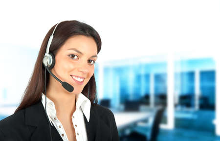 Smiling girl works in a call centerの写真素材