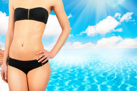 Tanned girl in swimming poolの写真素材