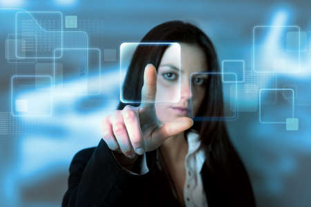 Businessgirl with a virtual touchscreen interfaceの写真素材