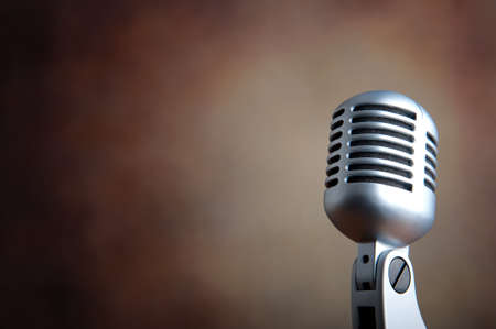 Old microphone against grunge backgroundの写真素材