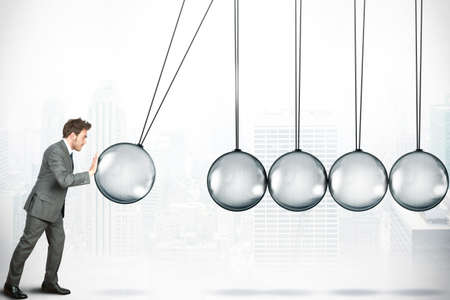 Business challenge concept with Newton cradleの写真素材