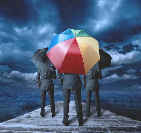 Businessman thinks positively during the stormの写真素材