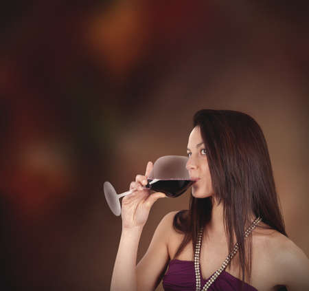Girl drinking wine in a pubの写真素材