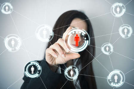 Businesswoman supports social network on futuristic screenの写真素材