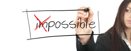 Businesswoman changes the impossible into possibleの写真素材