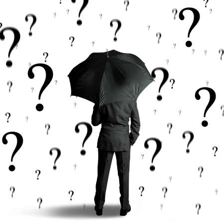 Concept of businessman surrounded by questionsの写真素材