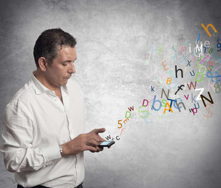 Businessman writing with touch screen phoneの写真素材