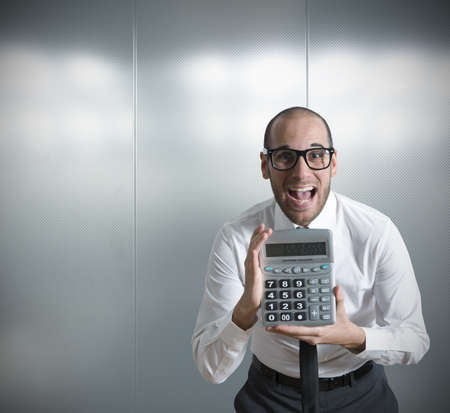 Businessman show calculator with positive valueの写真素材