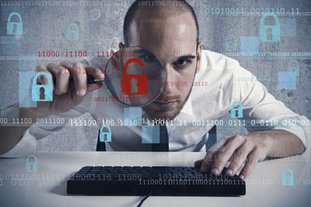 Businessman looking in a computer for virus and hacker