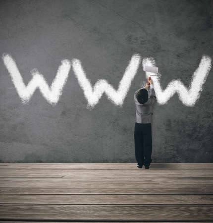 Concept of website under contruction with young businessman Concept of website under contruction with young businessman