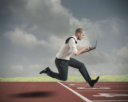 Challenge in business with running businessman with laptop