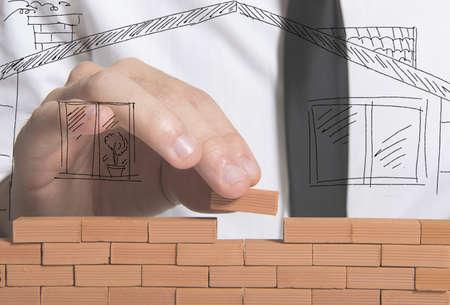 A businessman builds a new house conceptの写真素材