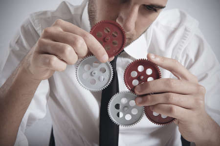 Teamwork concept with businessman working with gearの写真素材