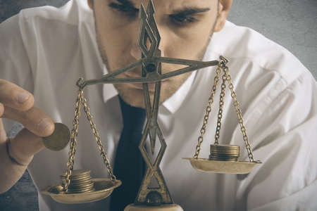 Businessman and earning balance conceptの写真素材