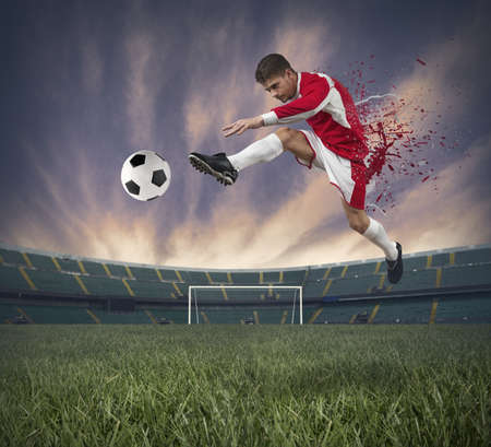 Concept of football player at stadium with spray effectの写真素材