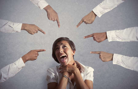 Concept of accused businesswoman with with fingers pointingの写真素材