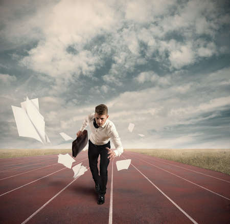 Business Competition with running businessman on the trackの写真素材