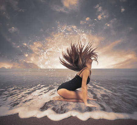 Dancer in the sea with drop and splash effectの写真素材