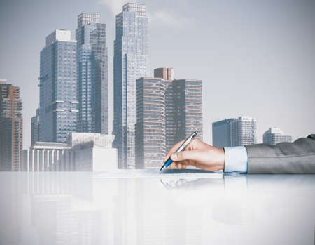 Businessman is signing a contract in officeの写真素材