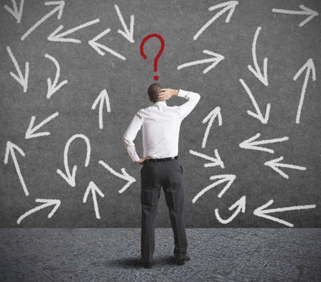 Concept of difficult choices of a businessman Concept of difficult choices of a businessman