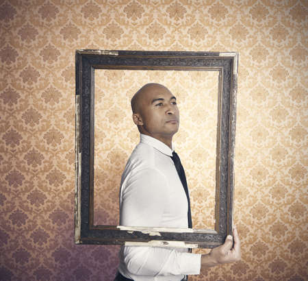Businessman proud of himself inside a frameの写真素材