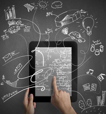 Man working with a multitasking tabletの写真素材
