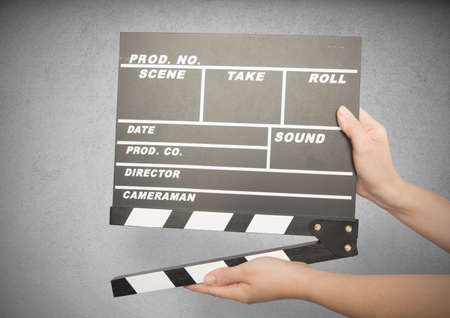 Movie clapper board against gray backgroundの写真素材