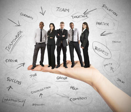 Hand holds a successful business team Hand holds a successful business team