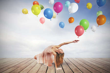 Young girl dance with colorful balloonsの写真素材