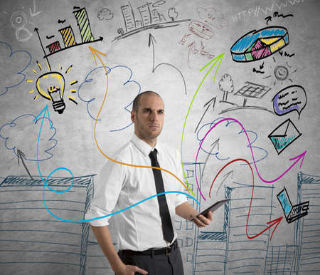 Concept of a businessman at work with tabletの写真素材