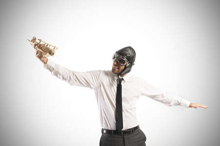 Concept of business in action with businessman with a toyの写真素材