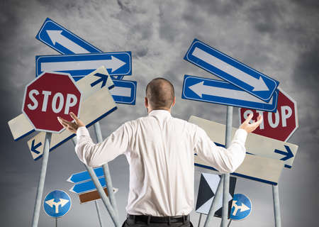 Concept of Choices and confusion of a businessmanの写真素材