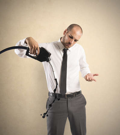 Concept of businessman with pump and lack of fuelの写真素材