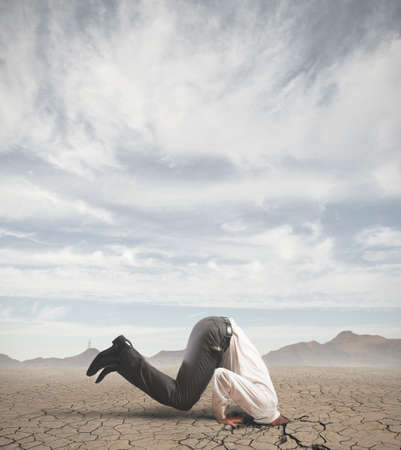 Concept of afraid businessman like an ostrichの写真素材