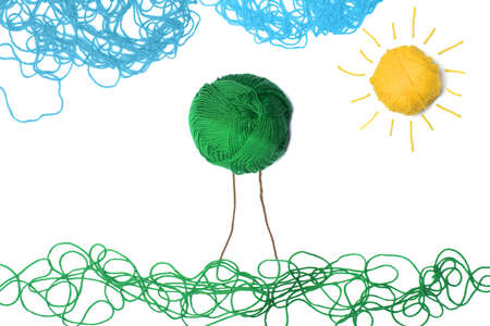 Concept of green field with ball woolの写真素材