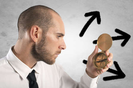 Concept of choose the right way with businessman and compassの写真素材