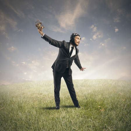 Concept of a businessman who dreams to flyingの写真素材
